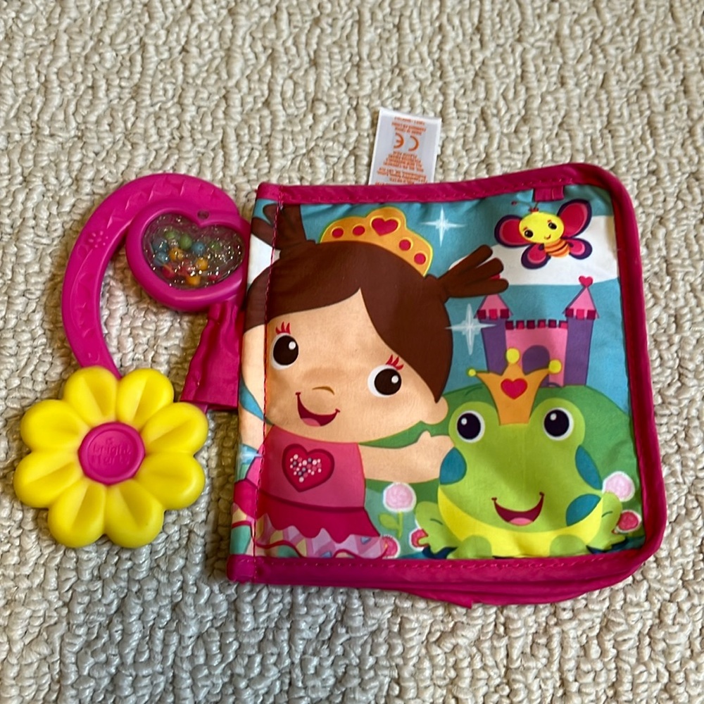 Bright Starts - soft cloth book with attached rattle and flower teething toy.